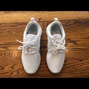 White laced up Nike sneakers